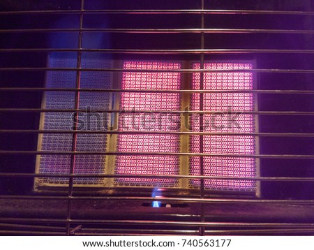 Pilot-flame on a portable gas heater Royalty-Free Stock Photo #740563177