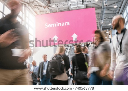 Seminar concept image - anonymous blurred business