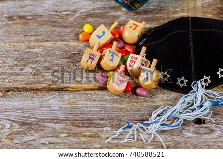 Jewish holiday, Holiday symbol Hanukkah Image of jewish holiday Hanukkah with wooden dreidel spinning top on the glitter background