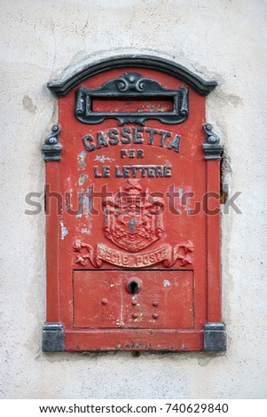 italian vintage mailbox, traditional old red box for mails, the translation is the following: "box for letters - royal mail service"