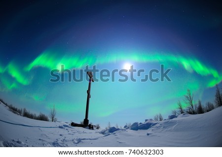 Road Cross On The Background Of The Northern Lights And The Moon, in Naryan-Mar, Nenets Autonomous Area, Russia.