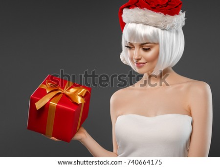 Santa Klaus woman with gift box.
