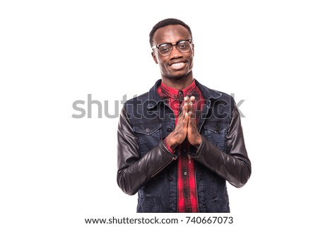 Handsome Afro American man in glasses is keeping palms together