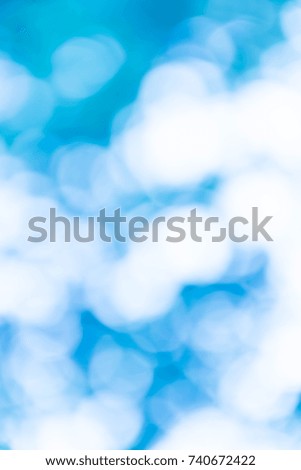blue natural background of out of focus forest or bokeh