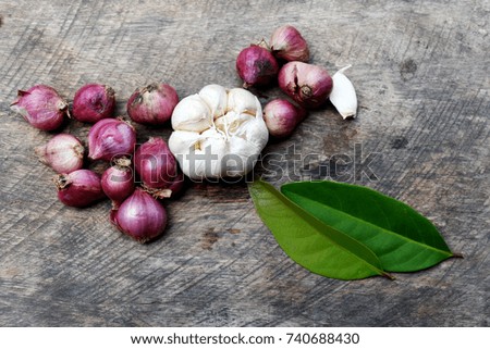 A creative image of garlic and onion from a wooden background