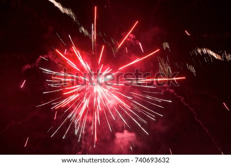 Bright fireworks against a night sky
