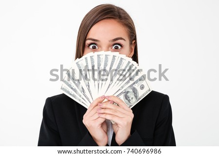 Photo of shocked business woman standing isolated over white background covering face holding money. Looking camera.