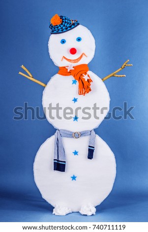 Beautiful funny Snowman in cap and scarf
	
