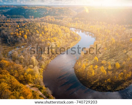 Aerial View of Colorful Forest Gills and River Gauja in Autumn during Sunset Time, Sigulda, Latvia