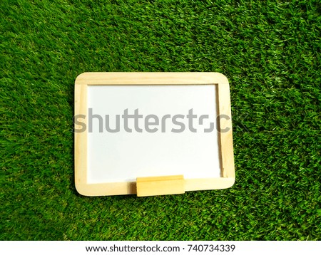 white board on green grass. 