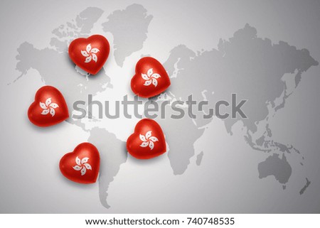 five hearts with national flag of hong kong on a world map background. i love hong kong.concept