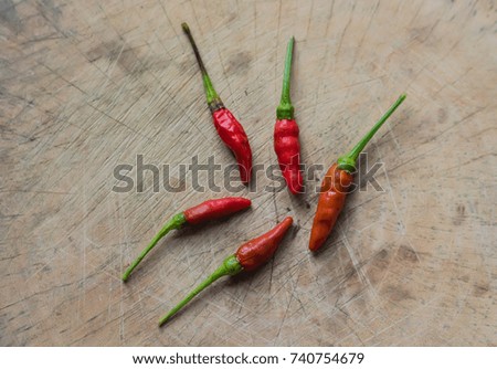 5 chili peppers on the cutting board