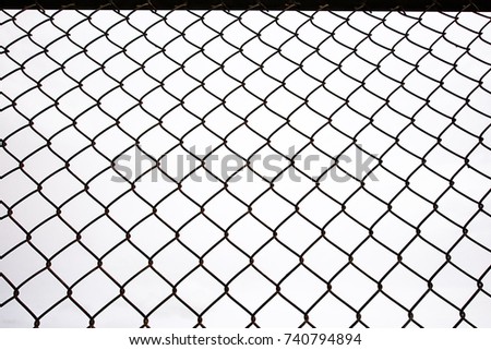 Texture the cage metal net isolate on white background. fence with barbed wire Royalty-Free Stock Photo #740794894