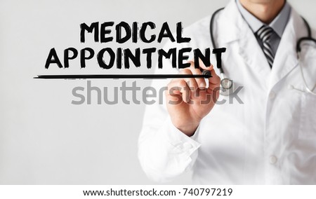 Doctor writing word MEDICAL APPOINTMENT with marker, Medical concept