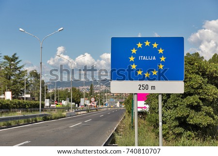 Highway with board road sign 250 m to Italy in Skofije, Slovenia.