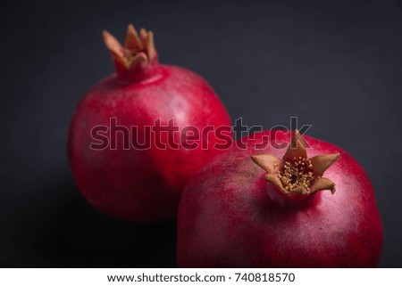 Fresh pomegranate macro picture on isolated black background