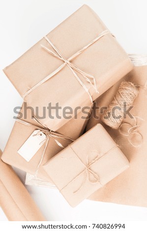 packages wrapped in brown paper and tied with twine