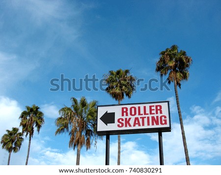 vintage roller skating rink sign with palm trees                               