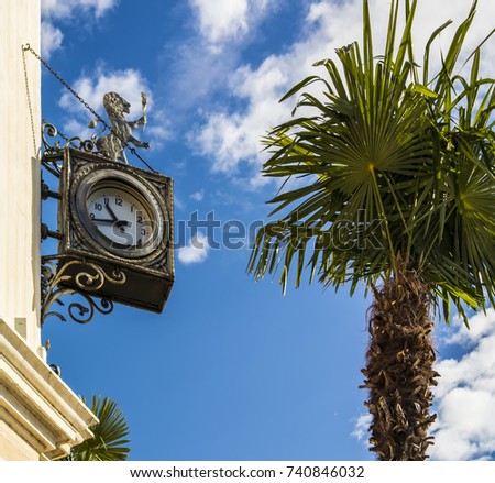 Clock with lion located on a palace in Salò, Brescia - Italy