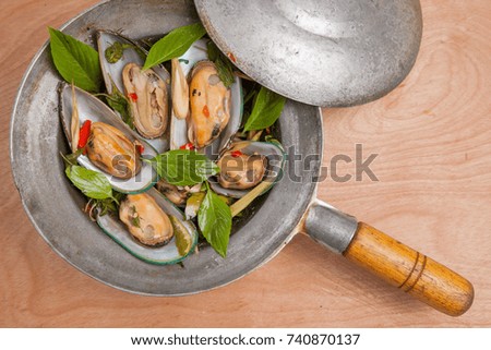 Fried mussel Basil food from Thailand.