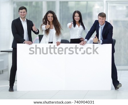 business team holding blank white banner