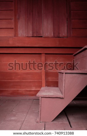 old vintage wood stairs in red color
