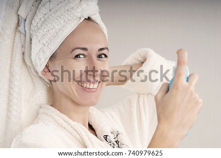girl in a Bathrobe with spray