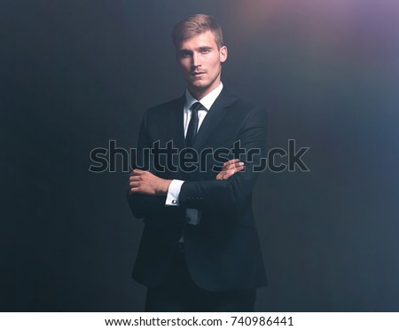 portrait of successful happy businessman in a gray business suit