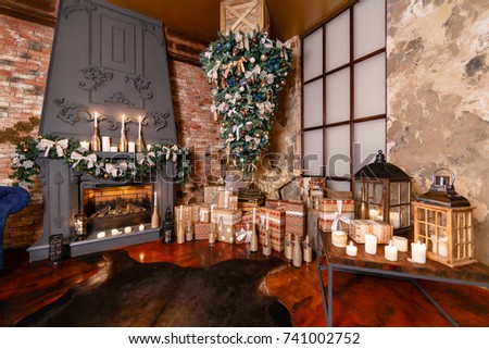 alternative tree upside down on the ceiling. Winter home decor. Christmas in loft interior against brick wall. Royalty-Free Stock Photo #741002752
