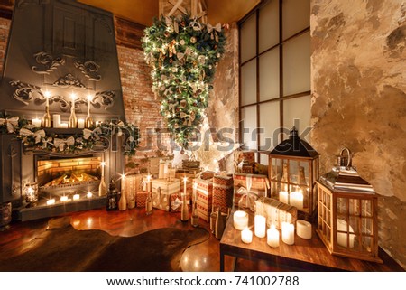 alternative tree upside down on the ceiling. Winter home decor. Christmas in loft interior against brick wall. Royalty-Free Stock Photo #741002788