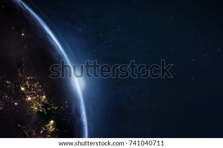 Earth with sun light. City lights on planet. Civilization. Elements of this image furnished by NASA