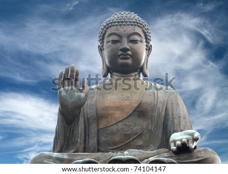 The Tian Tan Buddha in Hong Kong in a  dramatic sky background