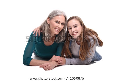 Mother and daughter sitting together