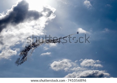 Backlight photo, "A-10 Thunderbolt" attacker flying through the flare