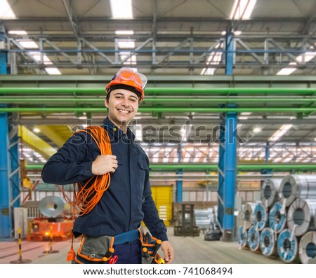 Portrait of a smiling engineer in a factory