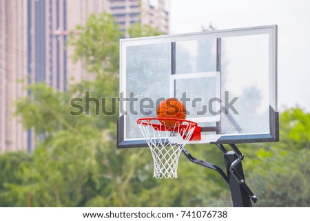 exact hit of a basketball ball into the basket
