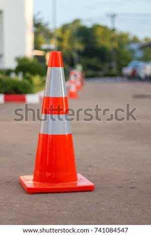 Orange traffic cones in the street.