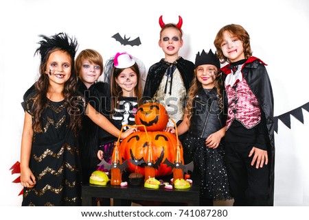 Halloween party. Funny kids in carnival costumes