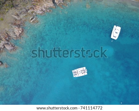 Aerial view above two catamarans along islands in the British Virgin Islands