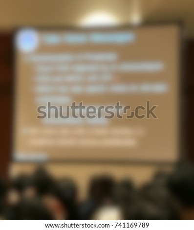 Abstract blurred photo of conference hall or seminar room, business concept