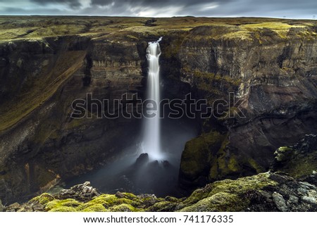 Dramatic landscape of Haifoss Waterfall in Landmannalaugar canyon, Iceland Royalty-Free Stock Photo #741176335