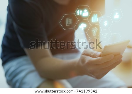 Man holding smart phone making online shopping and banking payment. Blurred background .
