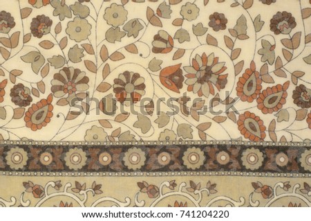 Background texture, pattern. Fabric beige with a floral pattern. Designed for free spirit. Colors include olive green, pink, yellow and fuchsia against the backdrop of ivory. Desinger dare