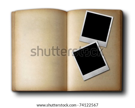 Two photo frames on old open book on white background