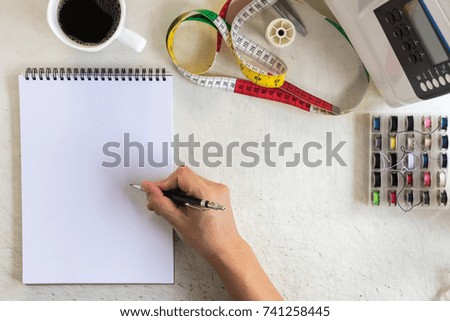 top view of tailor working desk. hand sketch drawing design fashion for sewing. space for text
