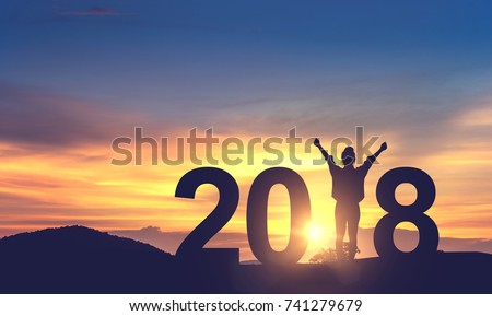 Silhouette freedom young woman Enjoying on the hill and 2018 years while celebrating new year, copy spce. Royalty-Free Stock Photo #741279679