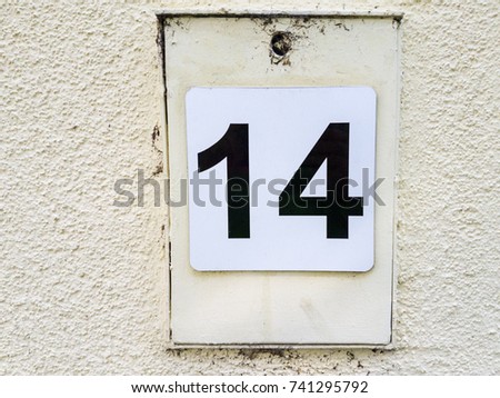 number 14 house number on the wall fourteen (14)