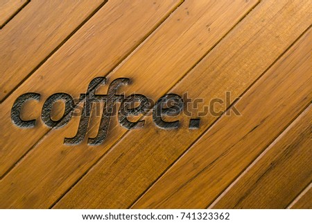 Wood texture background and text on wood "Coffee".