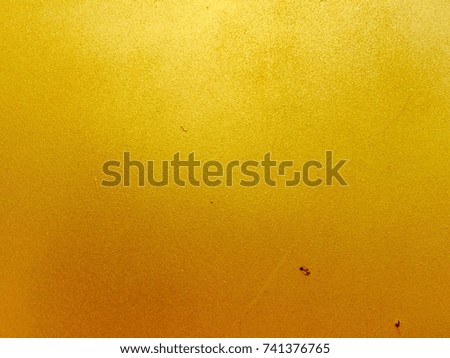 Golden metal surface texture backdrop for background design