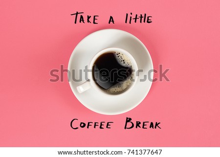 Top view of cup of black coffee and Take a little coffee break lettering isolated on pink background